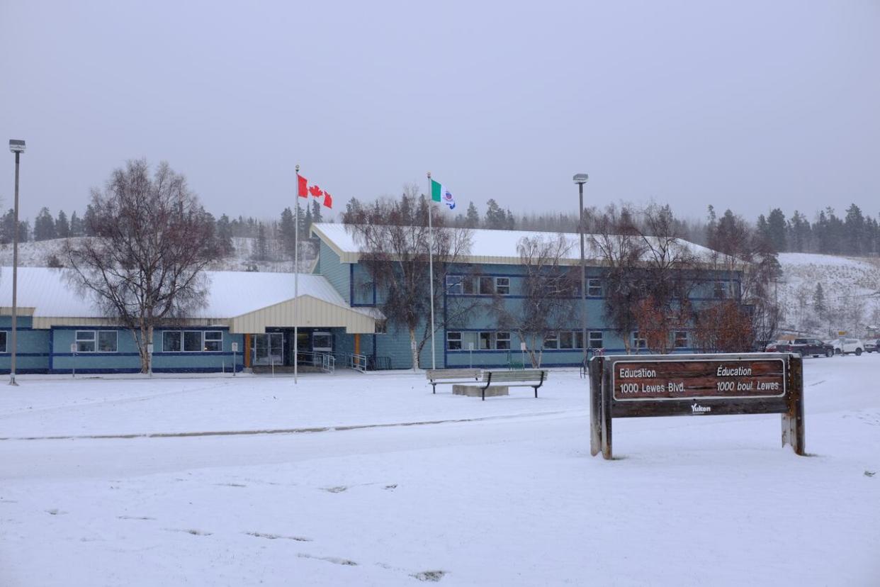 The Department of Education building in Whitehorse. On Thursday, Education Minister Jeanie McLean issued a statement about criminal charges laid against a person who worked as a teacher-on-call at several Whitehorse-area schools. (Yukon Department of Education - image credit)