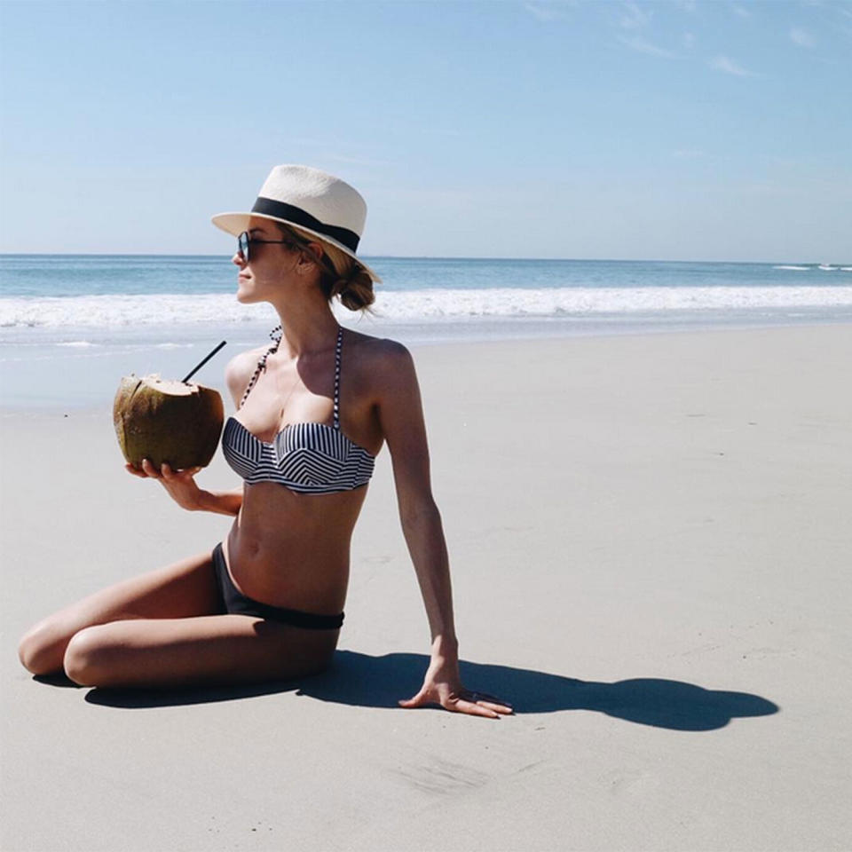 <p>Kristin was whisked away on a surprise <span>birthday trip to Mexico</span> by her husband, but still had the most important beach essentials on-hand — a nautical swimsuit (hers is by Audrina Patridge's line, <span>Prey</span>), a cute hat and plenty of oversize coconut drinks. </p>