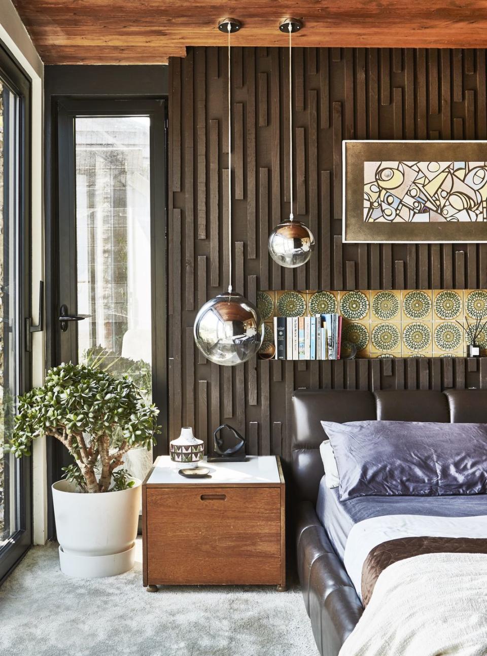 artisan tiles and panelled wall in bedroom