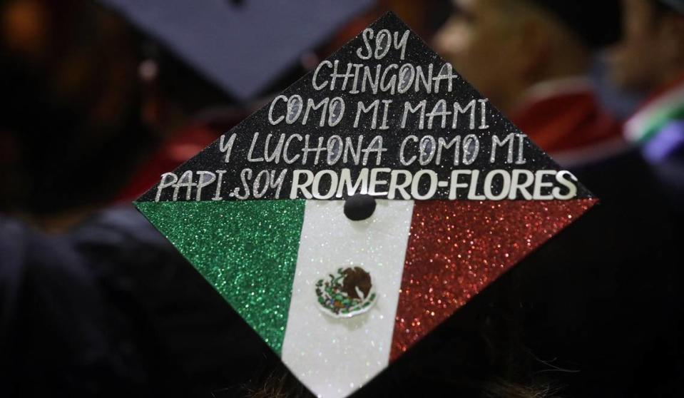 A graduate makes a statementn on her mortar board at the 47th Chicano/Latino Commencement Celebration at the Save Mart Center on May 20, 2023.