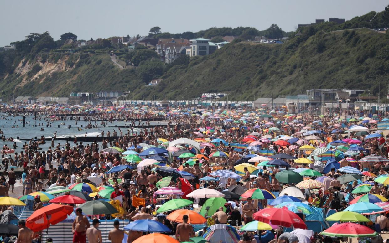 Crowds gather on the beach in Bournemouth as Thursday could be the UK's hottest day of the year with scorching temperatures forecast to rise even further.  - Andrew Matthews/PA