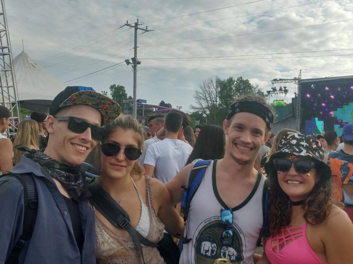 Cyla Daniels, far right, is pictured at Ever After Festival in Kitchener, Ont.. with friends from left to right, Cody James, Sabrina Ayton, and Colten James. Daniels says the group has attended the music festival every year since 2015, and in memory of Cody James who died in September 2018.  (Submitted by Cyla Daniels - image credit)