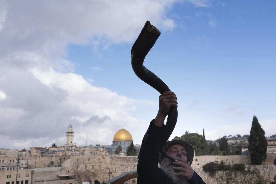 A man blows the shofar (ram's horn.) | Lior Mizrahi—Getty Images