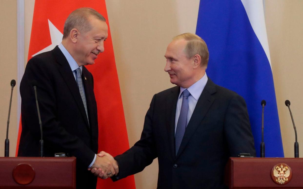 Recep Tayyip Erdoğan and Vladimir Putin emerged from marathon talks in Sochi with an agreement - AFP