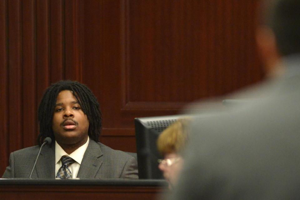 Darrion Ates, a Gate Gas station employee answers questions in the trial of Michael Dunn in Jacksonville, Fla., Monday, Feb. 10, 2014. Prosecutors rested their case Monday in the trial of Dunn who is charged with killing a teen after an argument over loud music outside a Jacksonville convenience store in 2012. (AP Photo/The Florida Times-Union, Bob Mack, Pool)