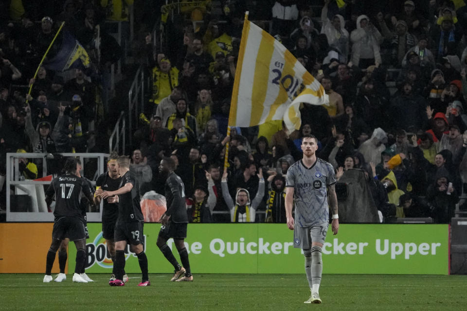 CF Montreal defender Joel Waterman (16) walks across the pitch as Nashville SC players celebrate a goal in the second half of an MLS soccer game, Saturday, March 11, 2023, in Nashville, Tenn. Nashville SC won 2-0. (AP Photo/Mark Humphrey)