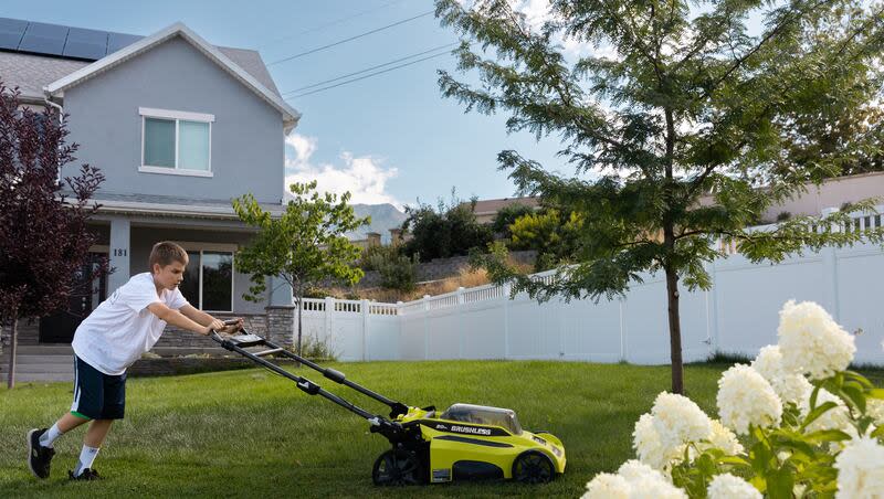 Justin Cox, 12, mows the lawn in front of his home in Lindon on Saturday, Aug. 26, 2023. Experts say that weather change and an increase in airborne irritants is making the allergy season worse.