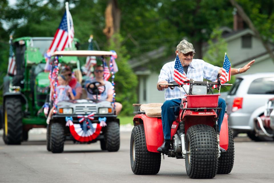 McDean Humphrey rides a souped-up tricycle during the third annual Independence Day Parade in Spring Creek, Tennessee on Tuesday, Jul. 4, 2023.