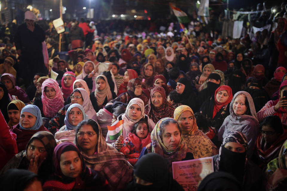 In this Saturday, Jan. 18, 2020 photo, women protesters listen to a speaker inside a tent at the protest site in New Delhi's Shaheen Bagh area, India. Muslim women are transcending the confines of their homes to lay claim to the streets of this nondescript Muslim neighborhood in the Indian capital and slowly transforming it into a nerve center of resistance against a new citizenship law that has unleashed protests across the country. The women, sitting in the middle of a major highway, have taken turns maintaining an around the clock sit-in for more than a month. They sing songs of protest and chant anti-government slogans, some cradling babies, others laying down rugs to make space for more people to sit. (AP Photo/Altaf Qadri)