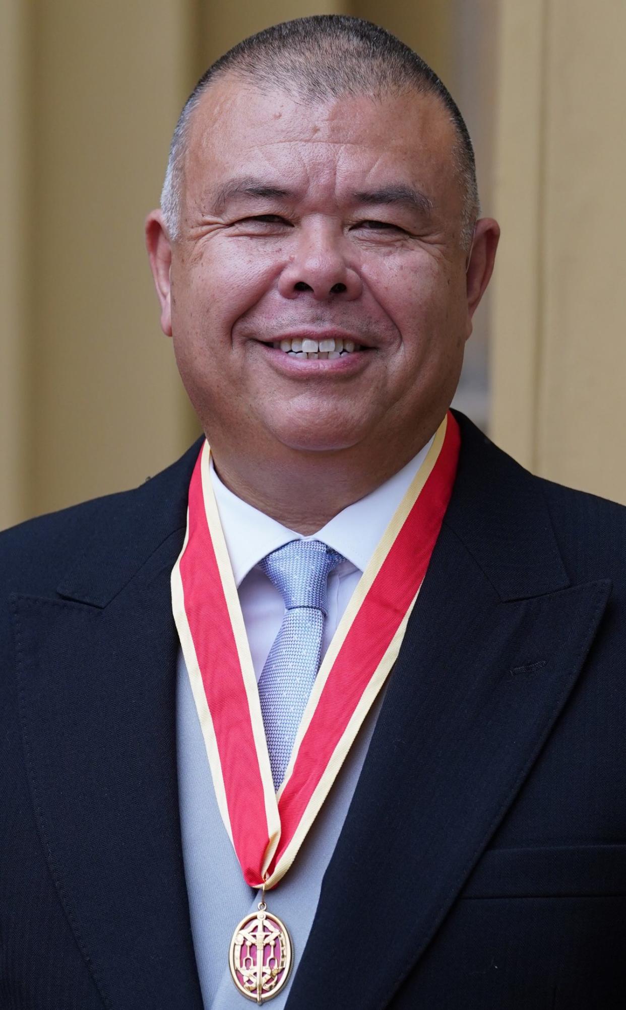 Proudly wearing his honour at Buckingham Palace in July 2022