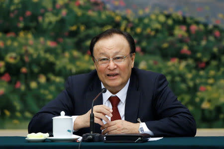 FILE PHOTO: The Chairman of the Xinjiang Uyghur Autonomous Region Shohrat Zakir talks during a session of the Xinjiang Uyghur Autonomous Region on the sidelines of the National People's Congress (NPC) at the Great Hall of the People in Beijing, China, March 13, 2018. REUTERS/Thomas Peter/File Photo