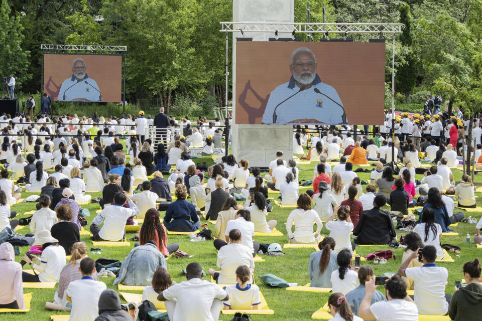 India Prime Minister Narendra Modi appears on the screen during the International Yoga day event at United Nations headquarters, Wednesday, June 21, 2023. (AP Photo/Jeenah Moon)