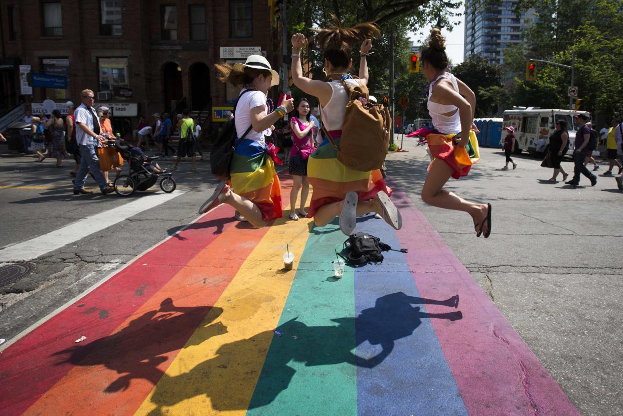 Rainbow-painted crosswalks like this one in Toronto are becoming popular, but not everyone approves.