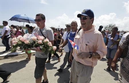 John Hemingway (R) and Patrick Hemingway (L), grandsons of the U.S. author Ernest Hemingway, walk before paying tribute to their grandfather in Cojimar village, Havana September 8, 2014. REUTERS/Enrique De La Osa