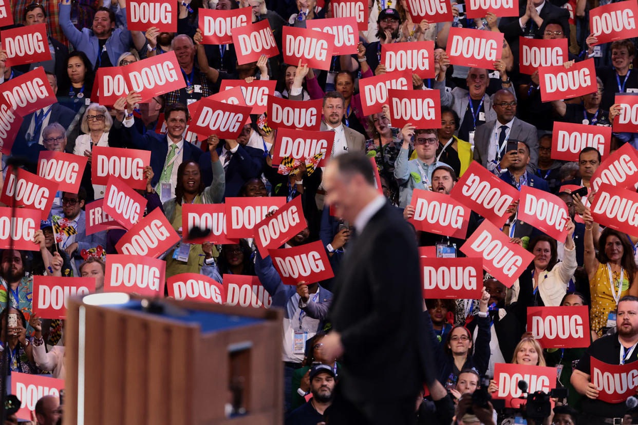 Delegates hold "Doug" signs (Hannah Beier / Bloomberg via Getty Images)