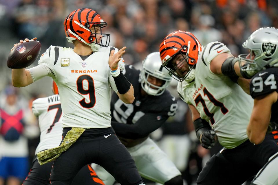 Cincinnati Bengals quarterback Joe Burrow (9) throws out of the pocket in the second quarter during a NFL Week 11 game against the Las Vegas Raiders, Sunday, Nov. 21, 2021, at Allegiant Stadium in Las Vegas.