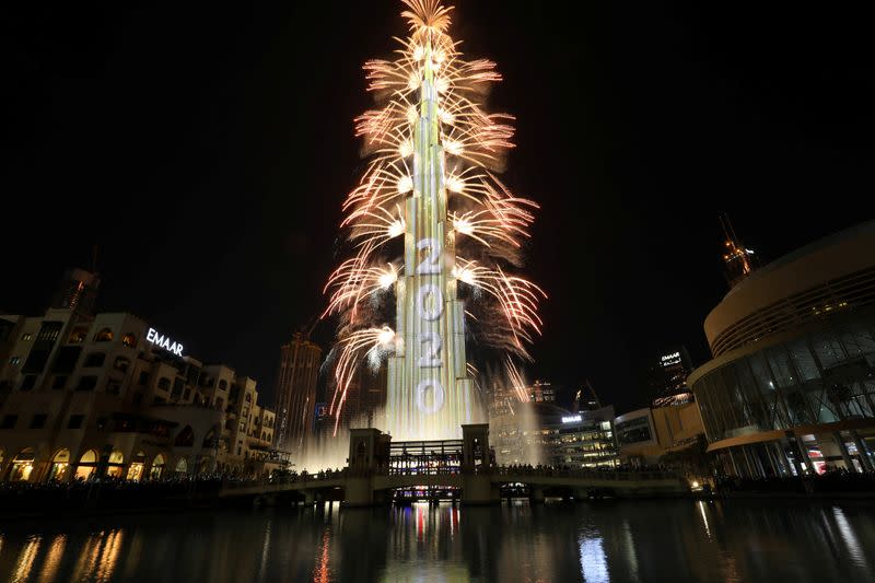 Fireworks explode around the Burj Khalifa, the tallest building in the world, during New Year's celebrations in Dubai