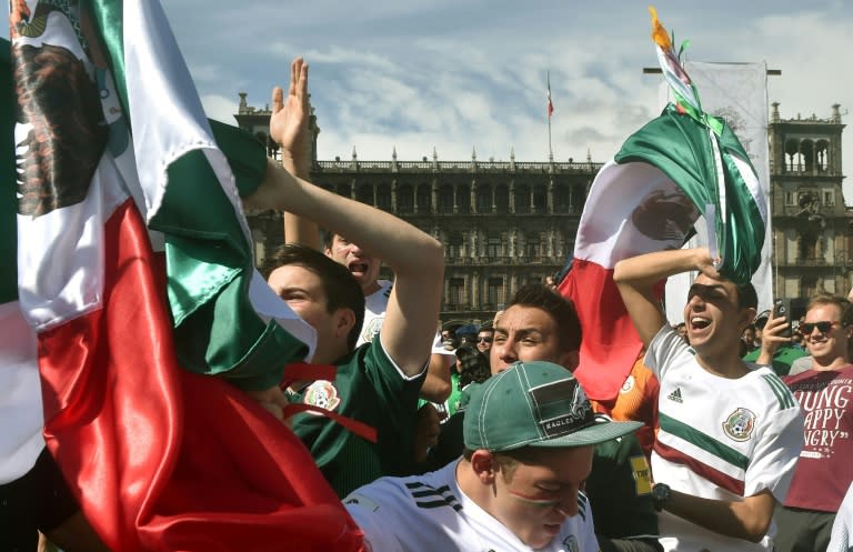 Mexico fans gathered in the capital's main Zocalo square erupt as their team defeated Germany at the World Cup