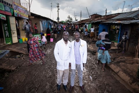 Health workers in Kibera slum, Nairobi - Credit: Simon Townsley/The Telegraph