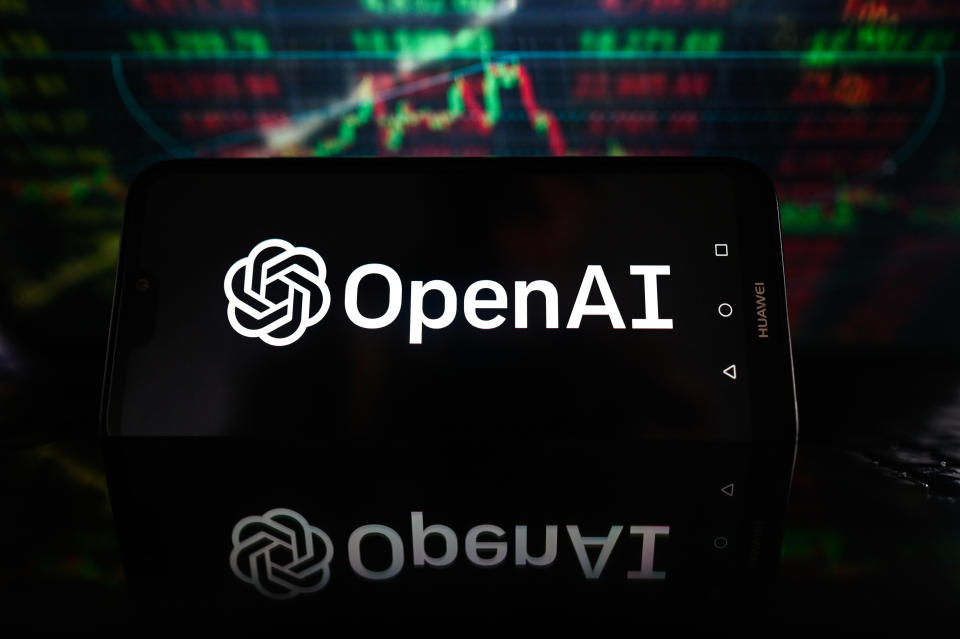 POLAND - 2023/10/19: In this photo illustration an OpenAI logo is displayed on a smartphone with stock market percentages on the background. (Photo Illustration by Omar Marques/SOPA Images/LightRocket via Getty Images)