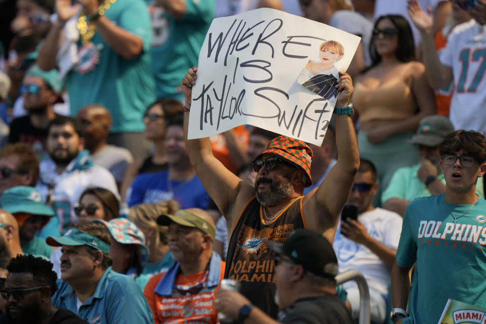 A Miami Dolphins fan displays a "Where is Taylor Swift" sign during the first half of an NFL football game against the Carolina Panthers, Sunday, Oct. 15, 2023, in Miami Gardens, Fla. (AP Photo/Wilfredo Lee)