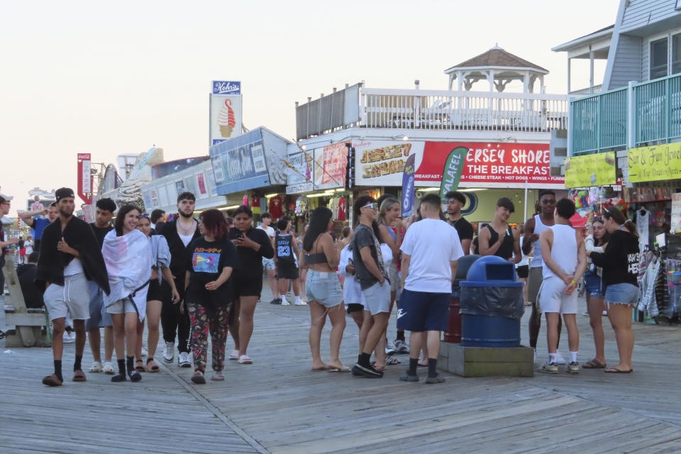 Crowds of people gather on the Seaside Heights N.J. boardwalk on June 2, 2023. On Feb. 23, 2024, New Jersey selected 18 Jersey Shore towns to split $100 million in funds to repair or rebuild their boardwalks. (AP Photo/Wayne Parry)