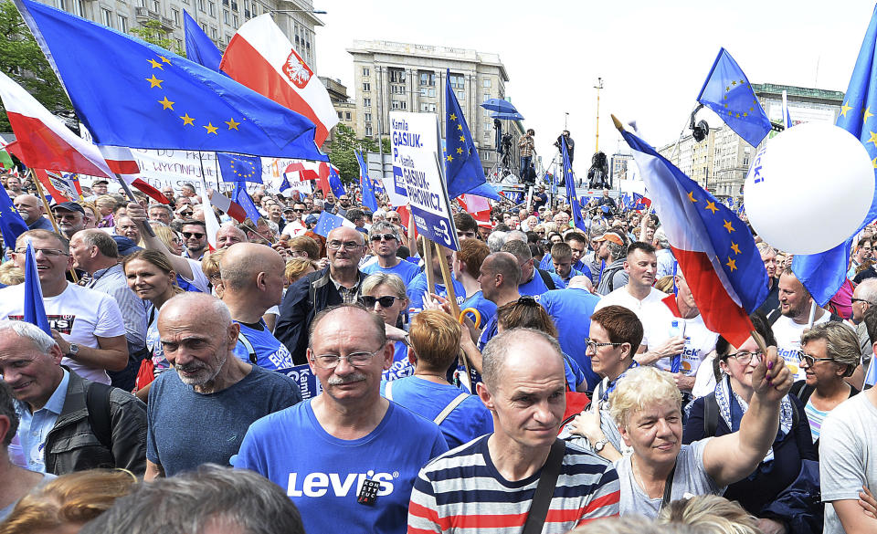 Thousands of Poles with pro-European banners march to celebrate Poland's 15 years in the EU and stressing the nation's attachment to the 28-member bloc ahead of May 26 key elections to the European Parliament, in Warsaw, Poland, Saturday, May 18, 2019. (AP Photo/Czarek Sokolowski)