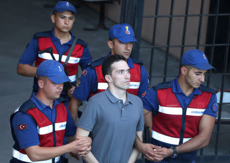 Angelos Mitretodis, one of two Greek soldiers who were detained after crossing the border into Turkey, is escorted by Turkish gendarmes as he leaves from a courthouse in Edirne, Turkey August 14, 2018. REUTERS/Ilkyaz Savas NO RESALES. NO ARCHIVES?