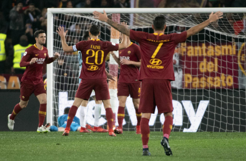 Roma's Ivan Marcano, left, celebrates with teammates after scoring a goal during the Italian Cup soccer match between AS Roma and Virtus Entella at the Olimpico stadium in Rome, Italy, Monday, Jan. 14, 2019. (Maurizio Brambatti/ANSA via AP)