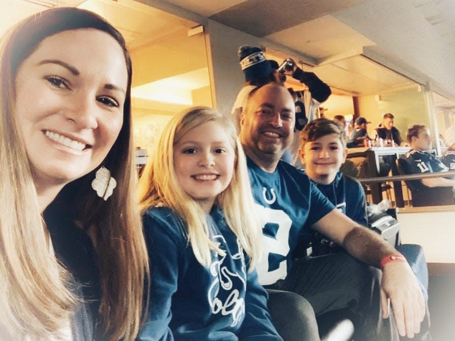 Eric Yazel sits in Colts general manager Chris Ballard's suite Sunday, Jan. 2, 2022, with his wife, Vicki, daughter Delaney and son Blaine at the game versus the Raiders.