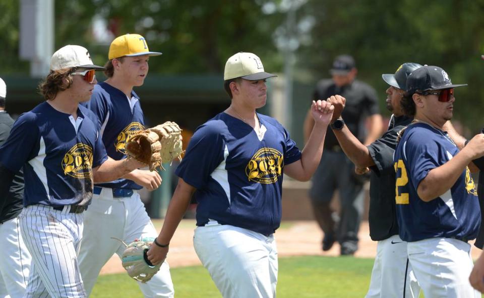 Enochs High senior pitcher Jon Ramirez All-Star Blue teammates walk off the field during the 32nd Modesto Sunrise Rotary All-Star Game at CSU Stanislaus on Saturday, June 8, 2024.