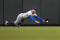 New York Mets center fielder Brandon Nimmo dives and catches a fly ball by St. Louis Cardinals' Nolan Gorman for an out during the fourth inning of a baseball game Tuesday, May 7, 2024, in St. Louis. (AP Photo/Jeff Roberson)