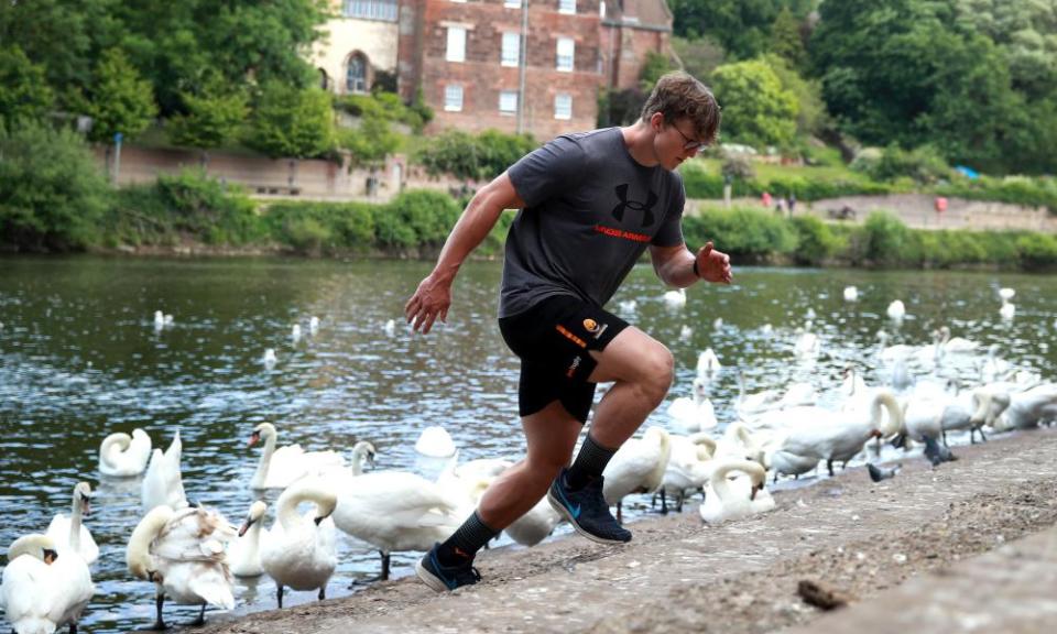 Ted Hill, the Worcester Warriors flank forward, works out on the banks of the River Severn in May.