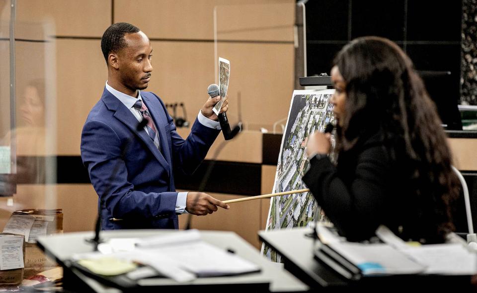 Former Florida State University football standout Travis Rudolph looks at a map of the scene of a shooting during cross examination by state attorney Francine Edwards at the Palm Beach County courthouse June 5, 2023 in West Palm Beach.