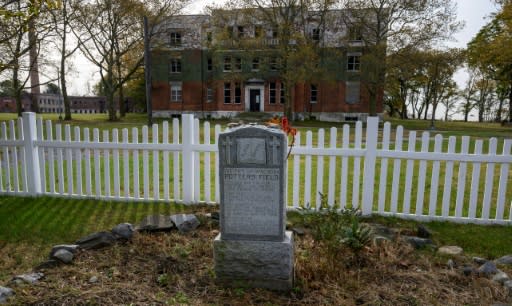 A memorial marker can be seen on the potter's field at Hart Island in October 2019 in New York