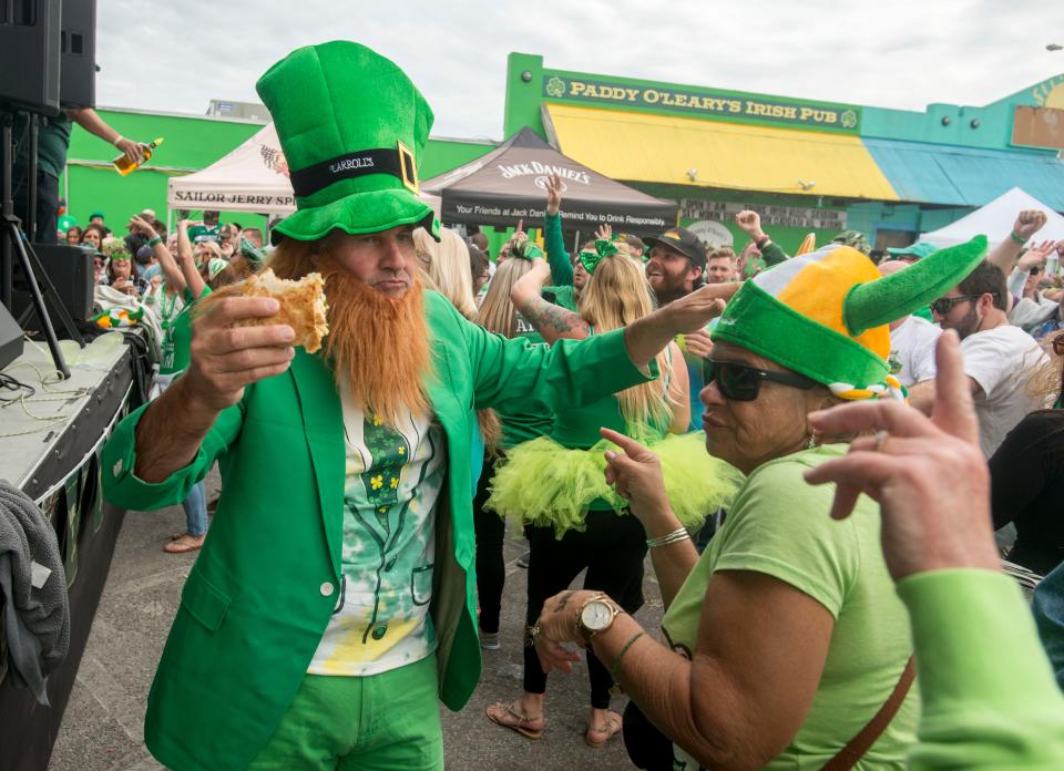 Revelers take in the spirit of St. Patrick’s Day Sunday, March 17, 2019 during the “Go Irish on the Island” Pub Crawl at Pensacola Beach.