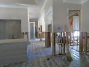 FILE - In this Oct. 25, 2017, file photo, a stack of sheetrock sits in the living room of Mary and Paul Daulong's home in Houston as they continue rebuilding after it was flooded during Hurricane Harvey. Although many Texas families are still struggling to recover from Hurricane Harvey a year after it caused widespread damage and flooding along the Gulf Coast and in and around Houston, daily life has mostly returned to normal in many of the hardest hit communities.(AP Photo/Juan Lozano, File)