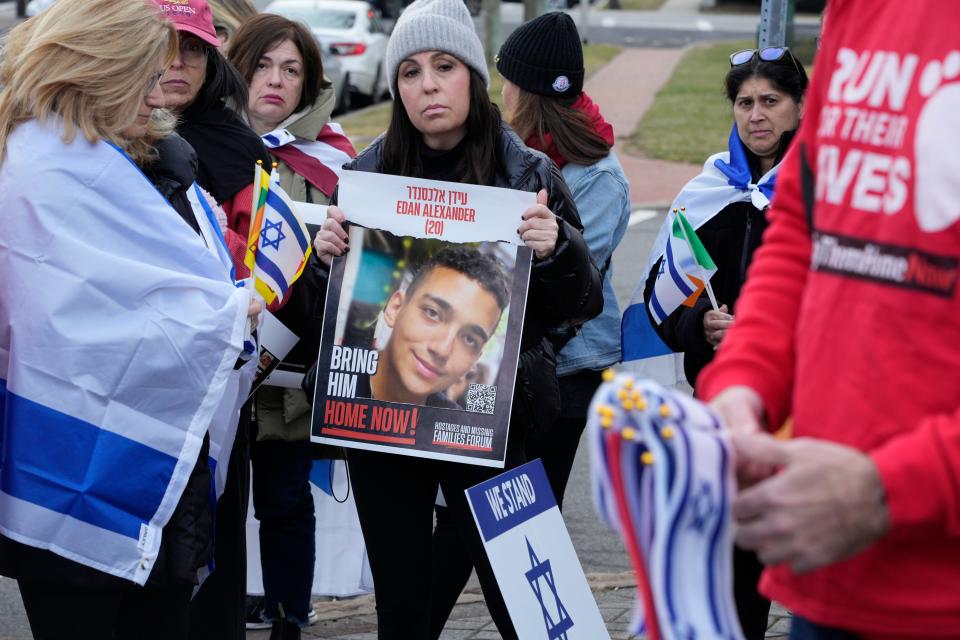 Center, Lana Platin, of Demarest, holds a poster of Edan Alexander, who has been held hostage in Gaza by Hamas. In Tenafly, NJ on Friday Feb. 9, 2024, the global organization Run For Their Lives holds their weekly walk around Tenafly on Fridays to ask for the release of the hostages in Hamas controlled Gaza.