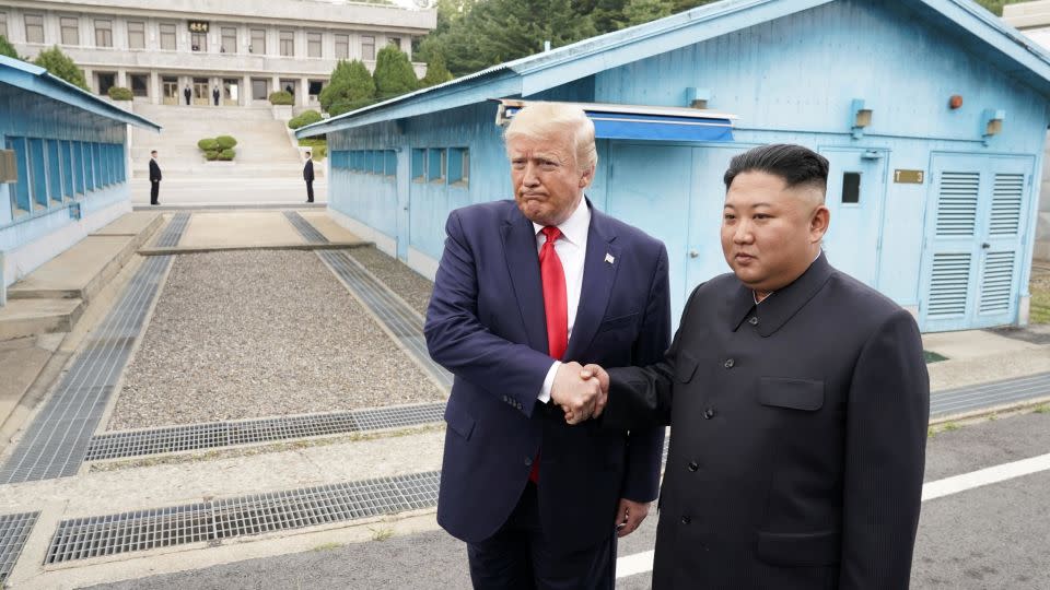 Former US President Donald Trump met with North Korean leader Kim Jong Un at the demilitarized zone in 2019. - KEVIN LAMARQUE/REUTERS
