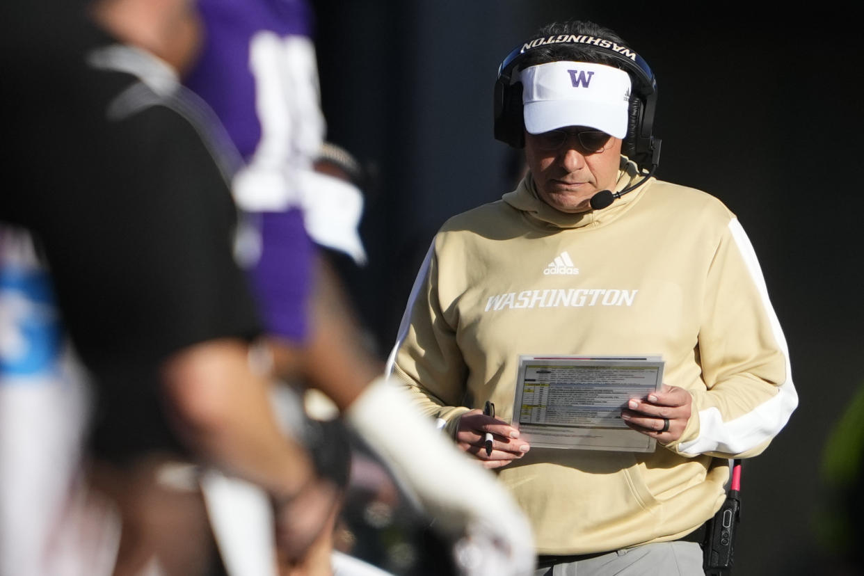 Washington head coach Jedd Fisch walks on the sideline during the first half of an NCAA college football game against Northwestern, Saturday, Sept. 21, 2024, in Seattle. (AP Photo/Lindsey Wasson)