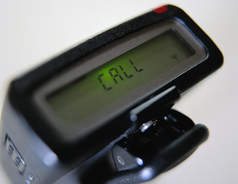 A pager with a message that says "Call."