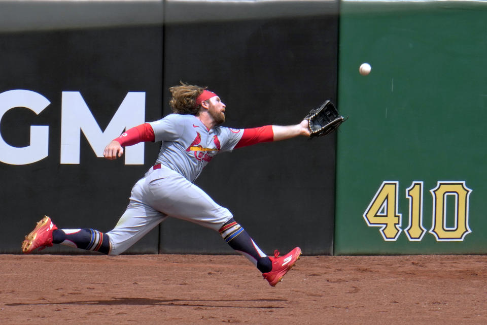 St. Louis Cardinals left fielder Brendan Donovan can't get to a ball hit by Pittsburgh Pirates' Jack Suwinski into deep left center field during the eighth inning of a baseball game in Pittsburgh, Thursday, July 4, 2024. The ball bounced over the outfield wall for a ground rule double. (AP Photo/Gene J. Puskar)