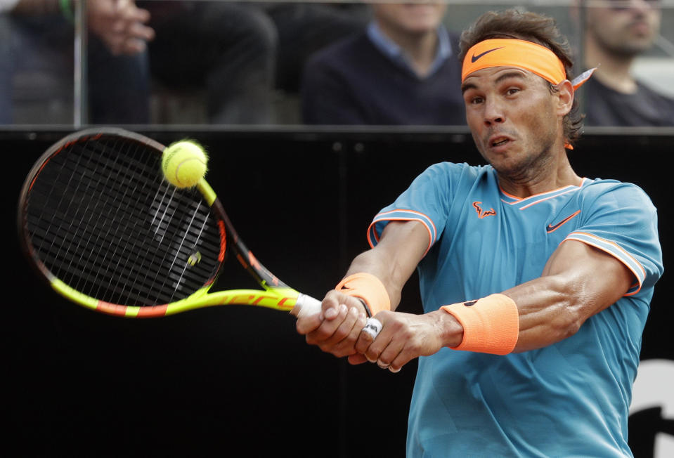 Rafael Nadal of Spain returns the ball to Novak Djokovic of Serbia during their final match at the Italian Open tennis tournament, in Rome, Sunday, May 19, 2019. (AP Photo/Gregorio Borgia)