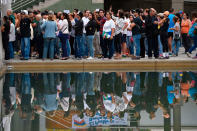 <p>People wait to cast their ballots on July 16, 2017 in Caracas, in an opposition-organized vote to measure public support for President Nicolas Maduro’s plan to rewrite the constitution, against a backdrop of worsening political violence. (Juan Barreto/AFP/Getty Images) </p>