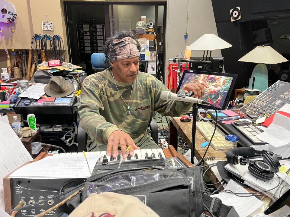 Actor Cylk Cozart concentrates as he prepares his mic to lay down some tracks adding 10 minutes to his film “Inherit the Land” at his studio on Middlebrook Pike Tuesday, Jan. 3, 2023.