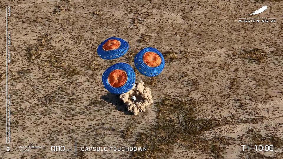 The New Shepard capsule touches down in a cloud of dust to close out a 10-minute up-and-down flight to the edge of space. / Credit: Blue Origin webcast