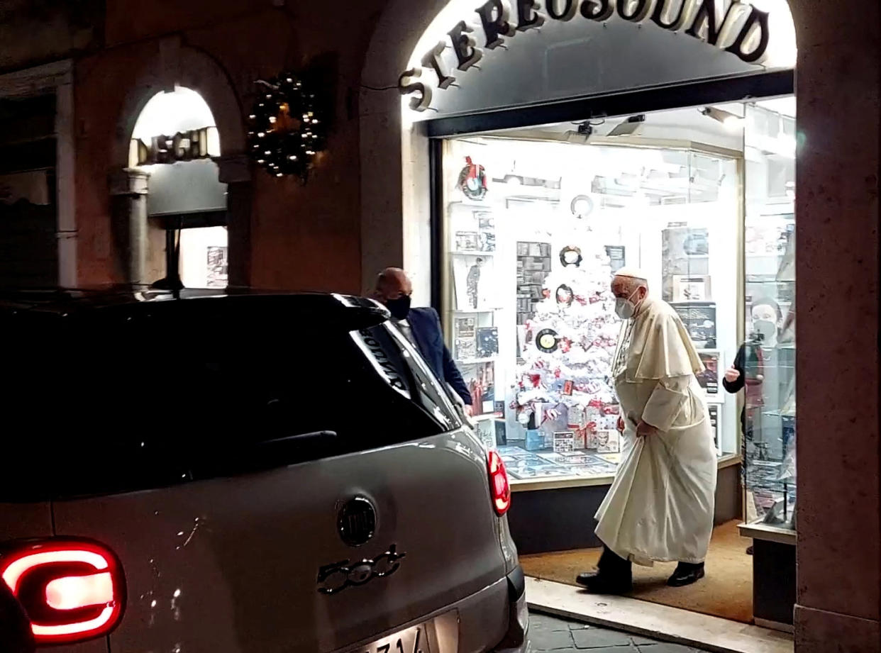 Image: Pope Francis walks out of a record shop in Rome on Jan. 11, 2022. (Rome Reports / via  Reuters)