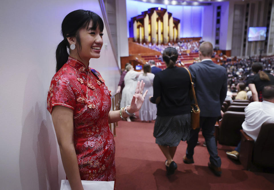 Sister Madison Ramos greets attendees during the Saturday morning session of the 192nd Semiannual General Conference of The Church of Jesus Christ of Latter-day Saints in Salt Lake City on Saturday, Oct. 1, 2022. (Jeffrey D. Allred /The Deseret News via AP)