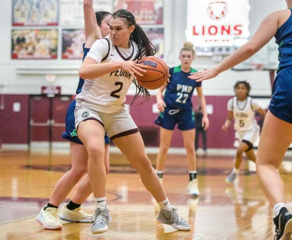 Peoria High's Denali Craig Edwards (2) battles the Peoria Notre Dame defense in the second half Thursday, Dec. 1, 2022 at Peoria High School. The Irish defeated the Lions 60-47.