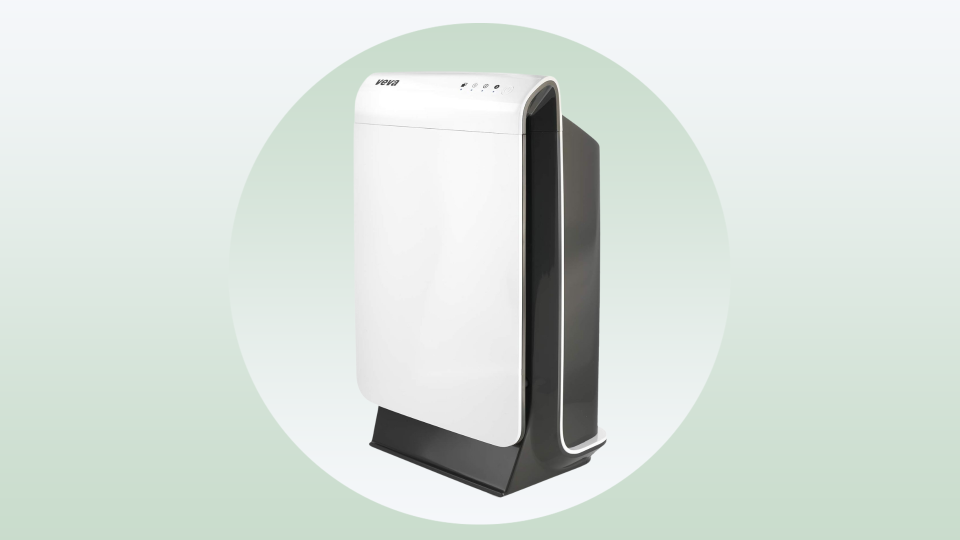 white air purifier on a green background